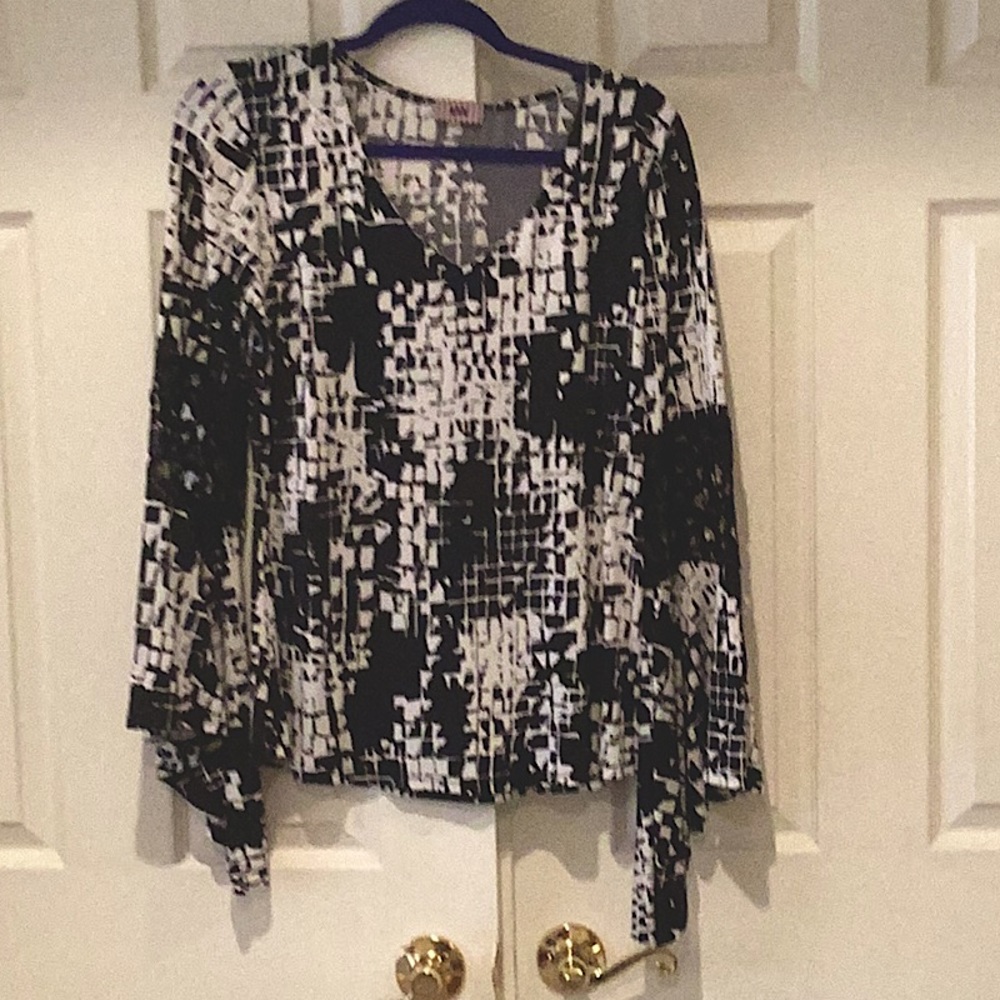 Top black and white with mesh on sleeve .Brand is MIX